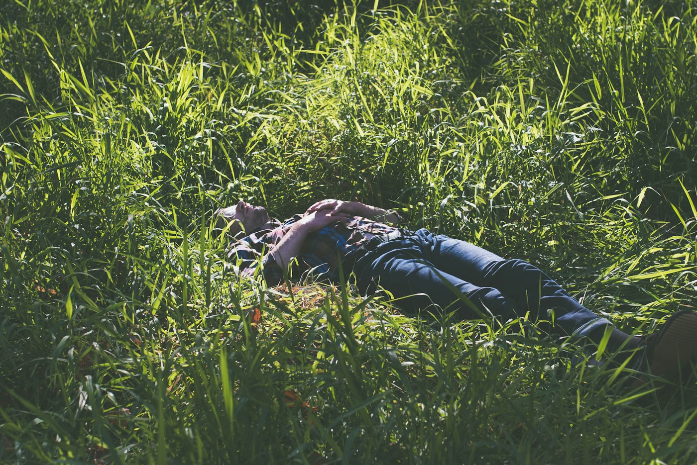 Man resting with his eyes closed on a pillow